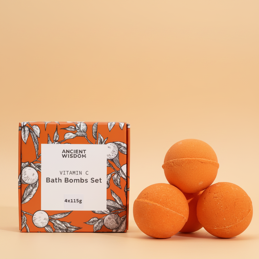 Orange bath bombs with packaging labeled 'Ancient Wisdom Vitamin C Bath Bombs Set' on a orange background