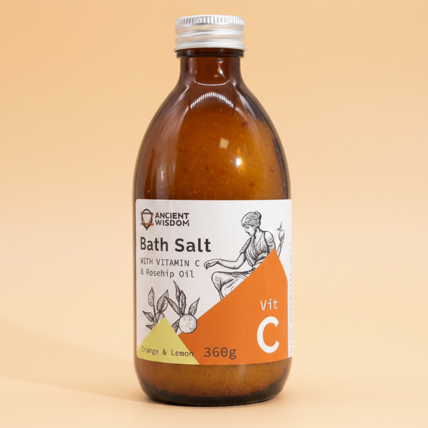 Bottle of bath salt with a label on a orange background
