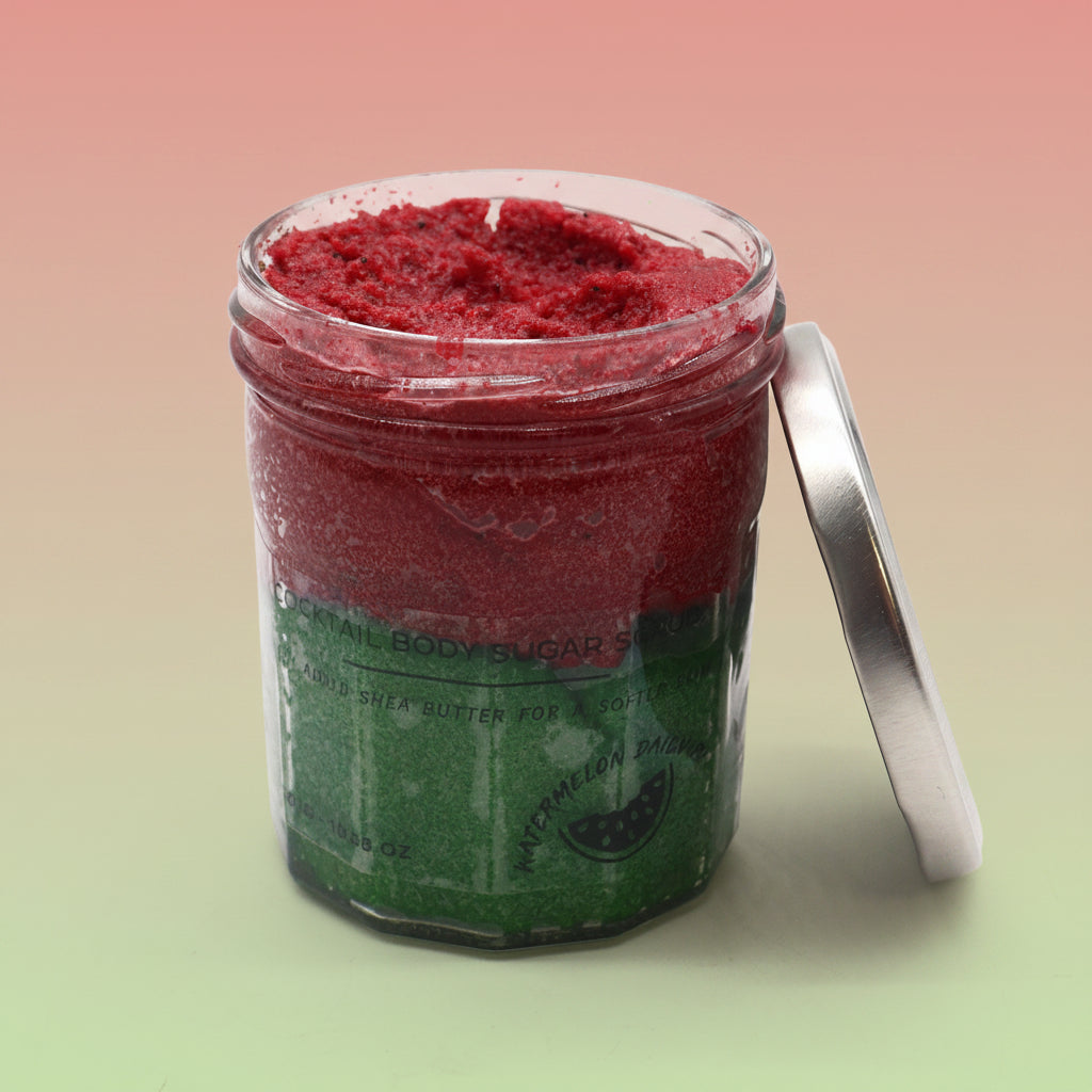 red and green body scrub in watermelon fragrance in glass jar