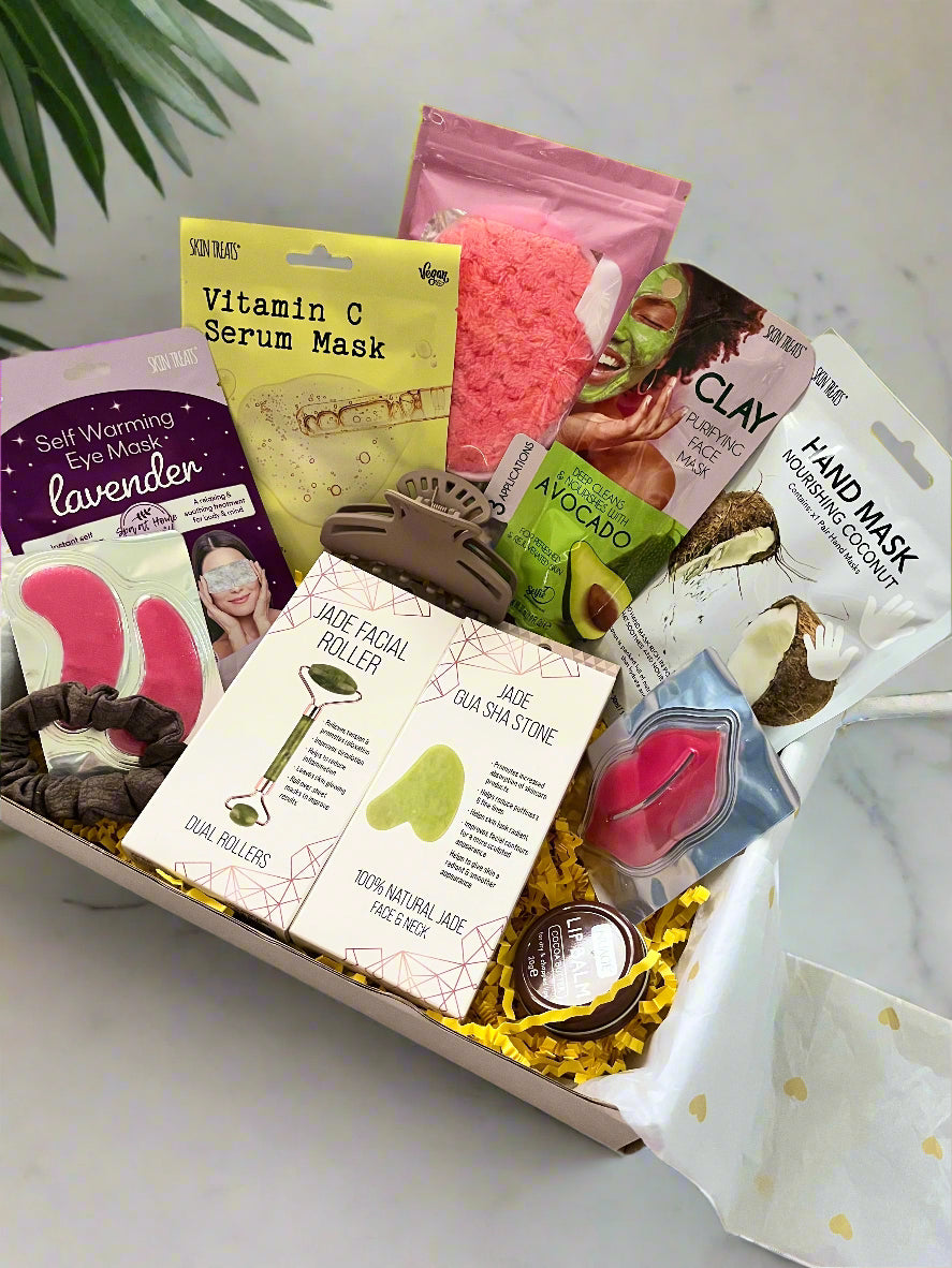 Assorted skincare products including masks and rollers in a box