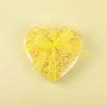 Bouquet of yellow roses with a yellow ribbon on a yellow background